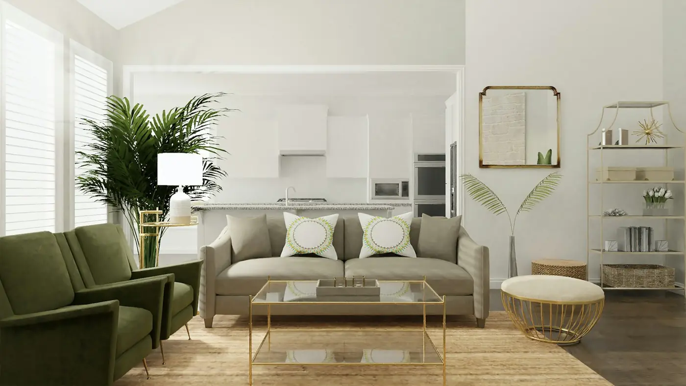 A bright, styled living room with a sofa, plants and a kitchen behind