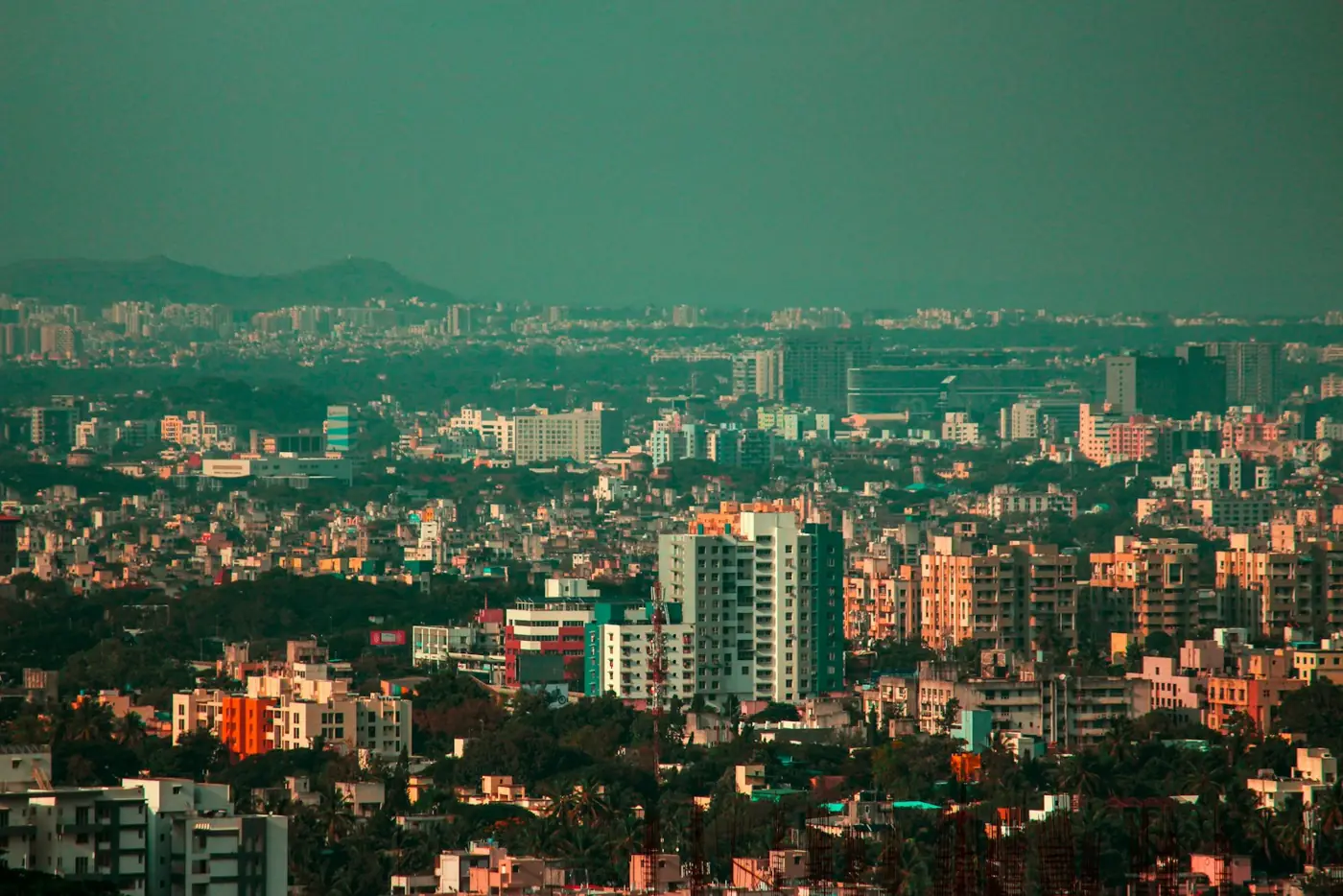 An aerial view of Pune's neighbourhoods and green hills
